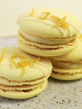 Load image into Gallery viewer, Vegan-lemon-macarons-filled-with-lemon-cream
